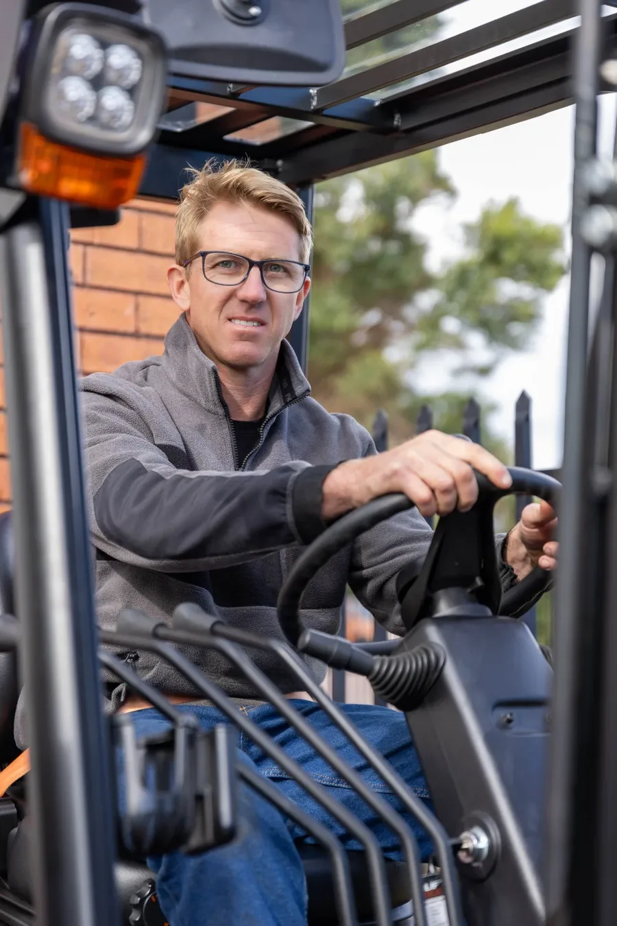 An operator seated in a machine cab