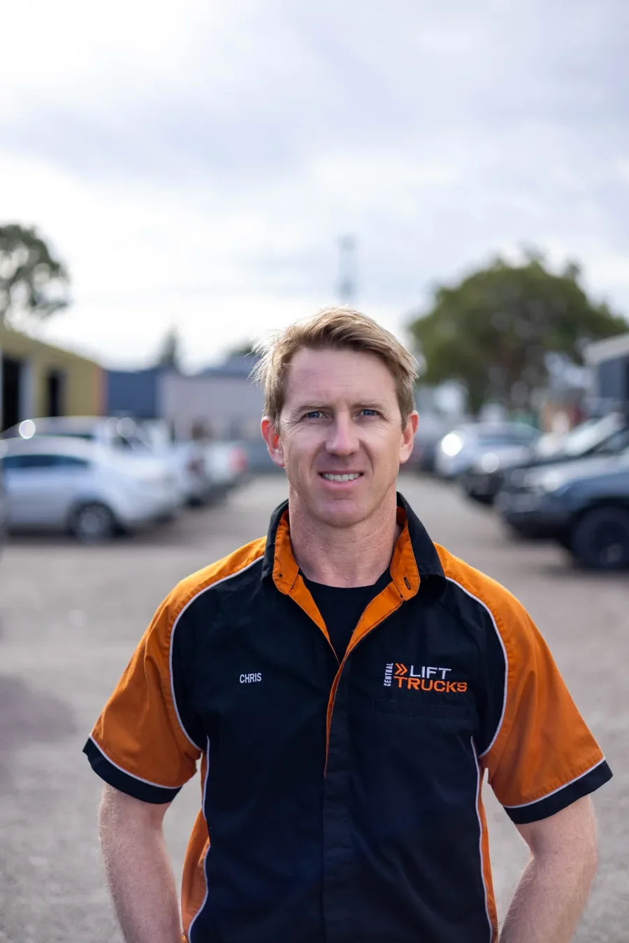 Chris in Central Lift Trucks uniform in the vehicle yard