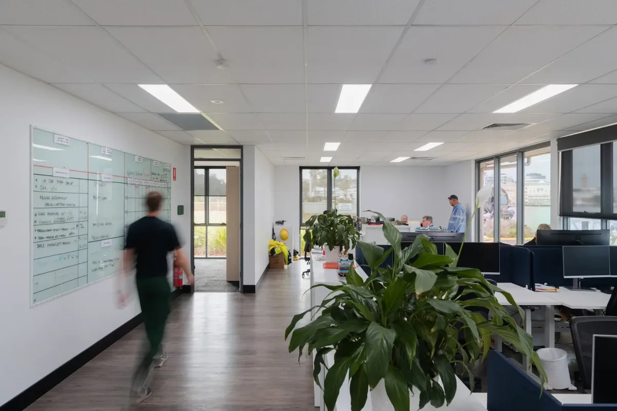 A team member walking through the open plan office