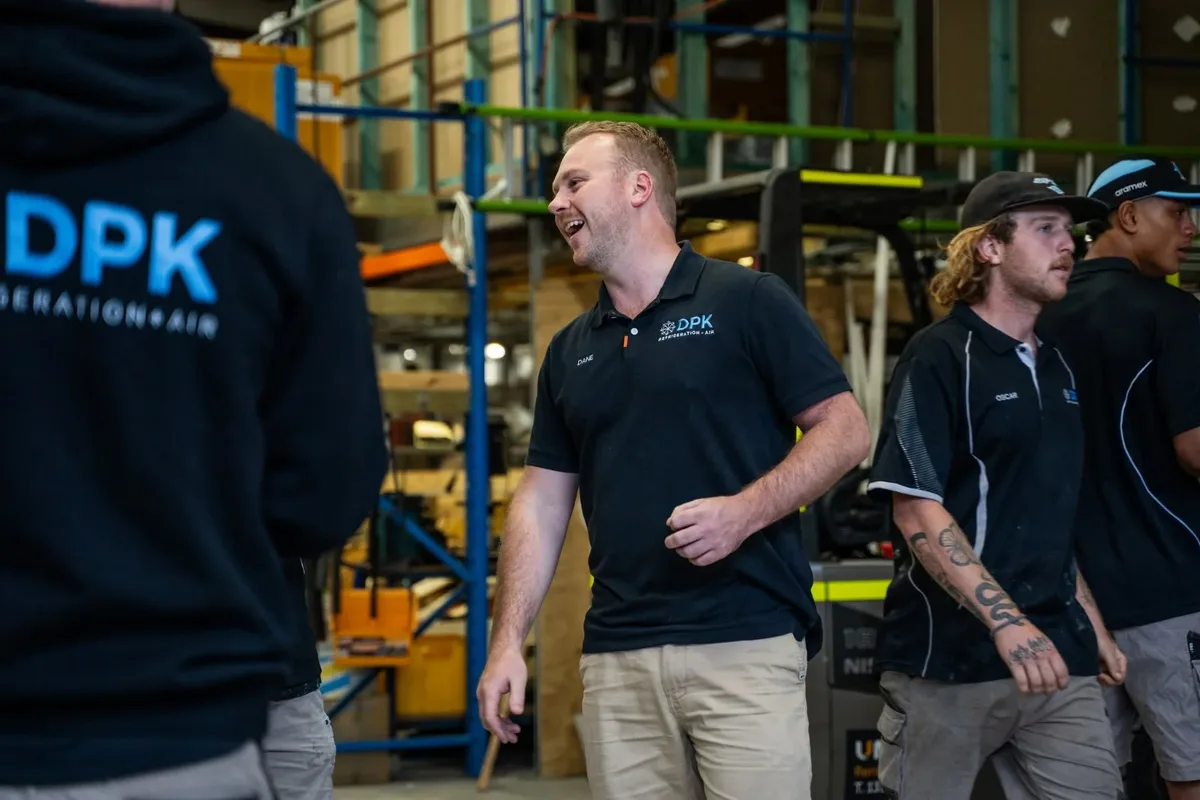 DPK operations team members talking in the warehouse