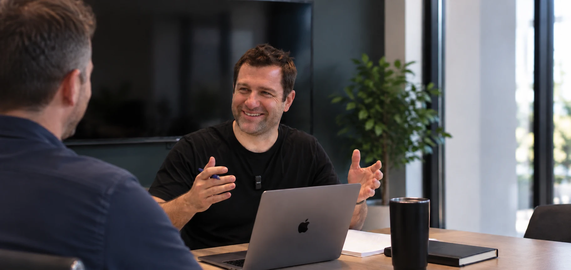 Andrew in conversation with a business owner