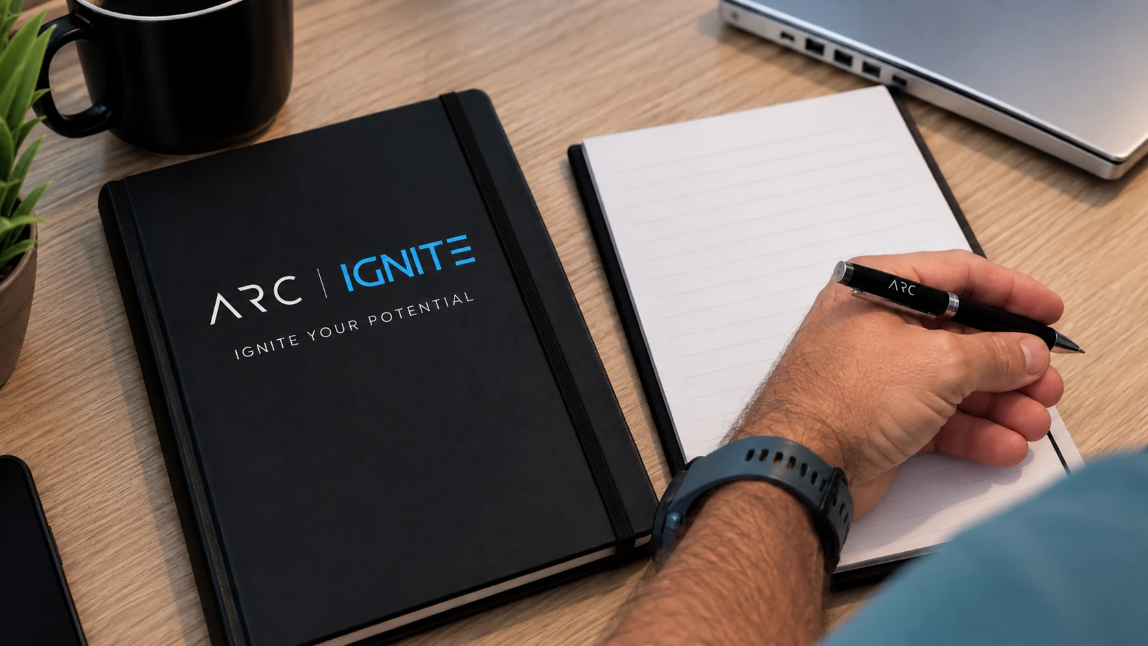 ARC IGNITE workbook, notebook and pen ready for a planning session
