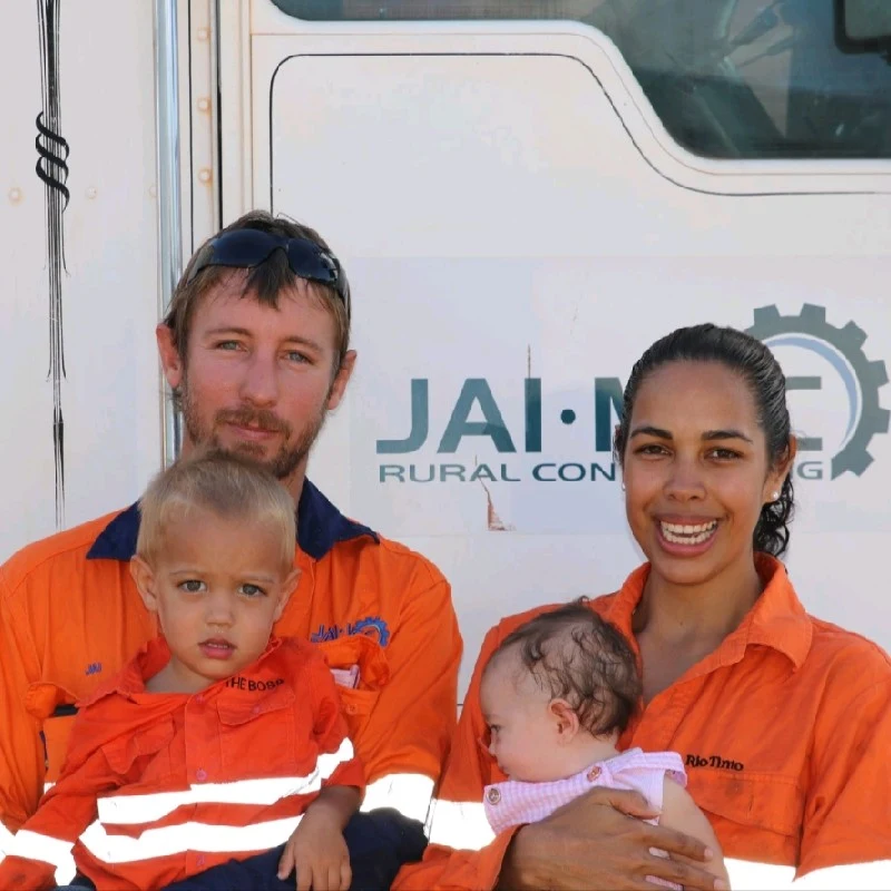 Jai and Sandi with their young family in front of a JAI-MEC vehicle