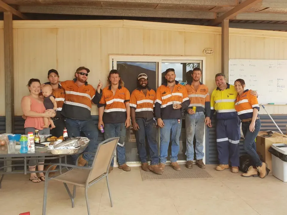 The team together outside the site office