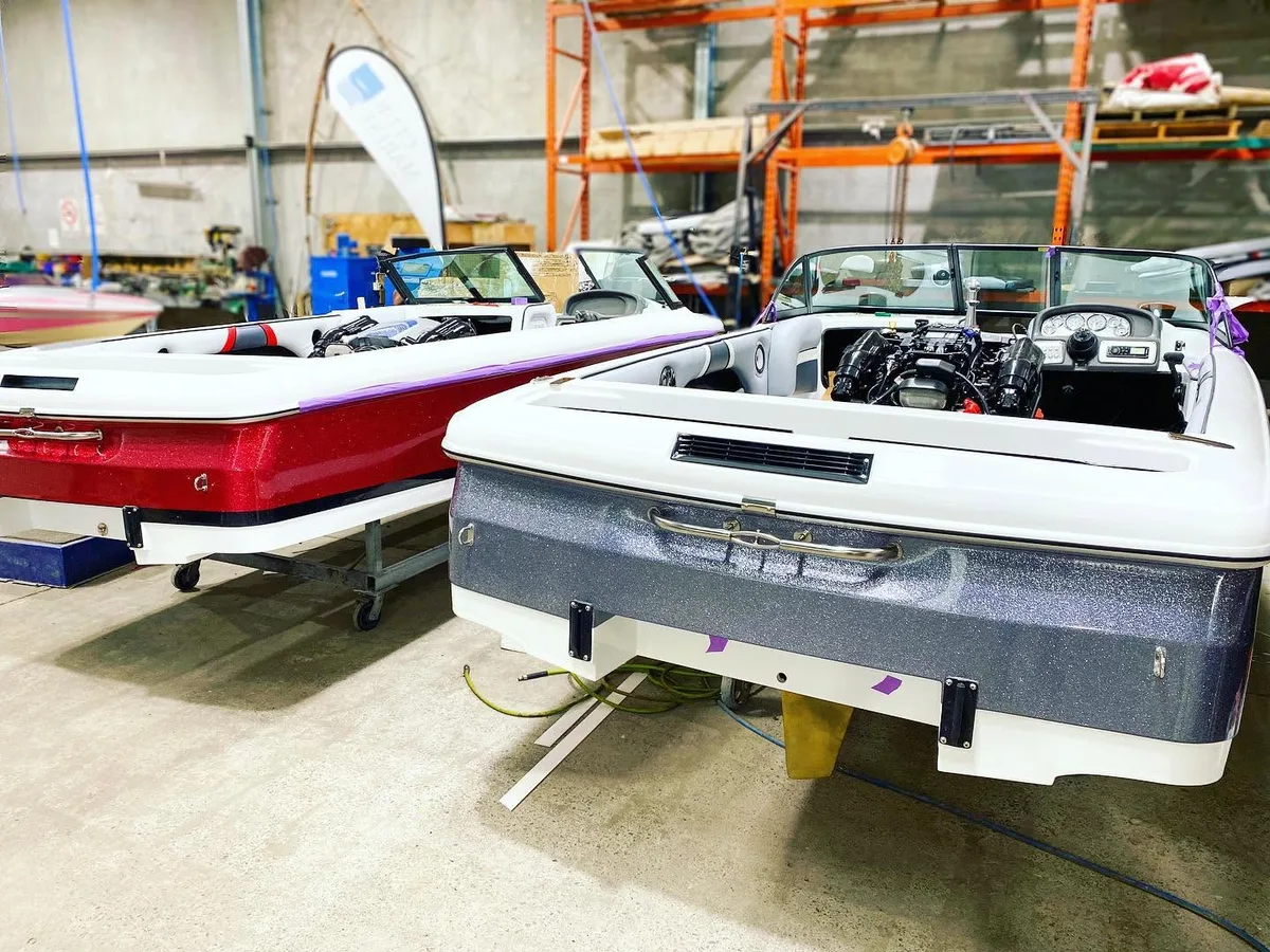 Lewis boats in the workshop with their engine bays open