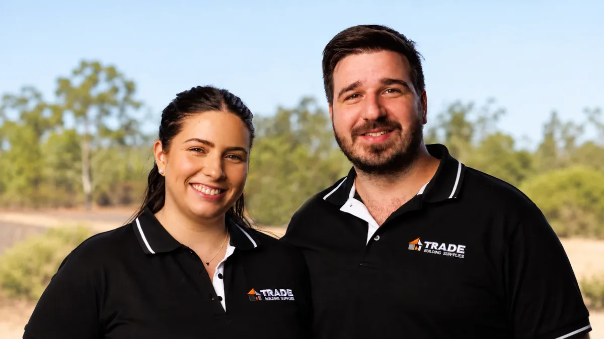 Alex and Skye in their Trade Building Supplies polos