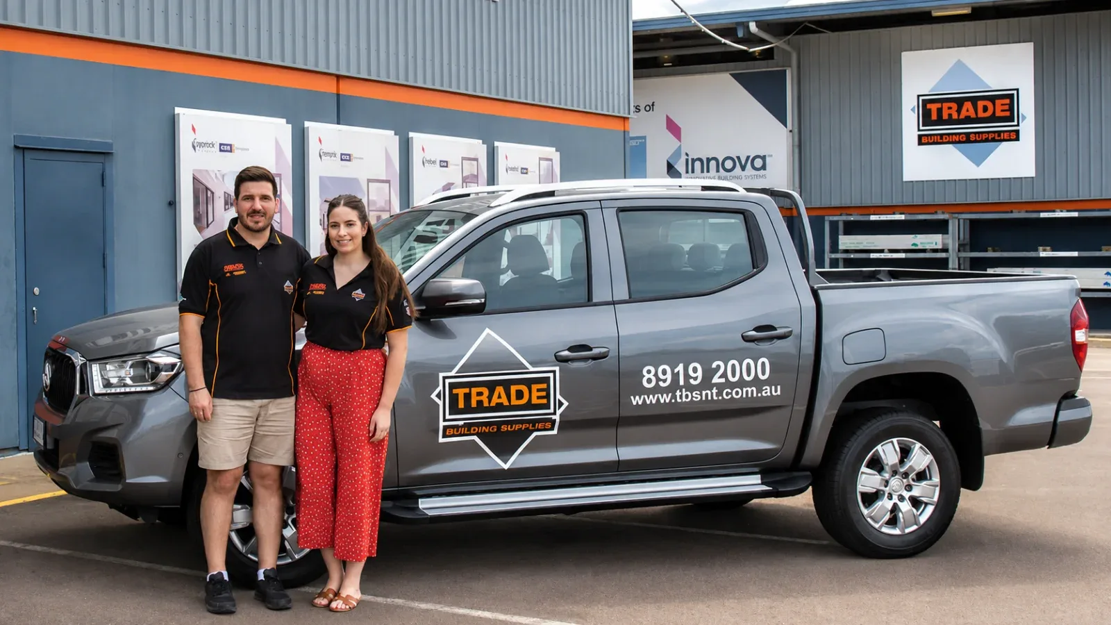 Alex and Skye with their Trade Building Supplies ute