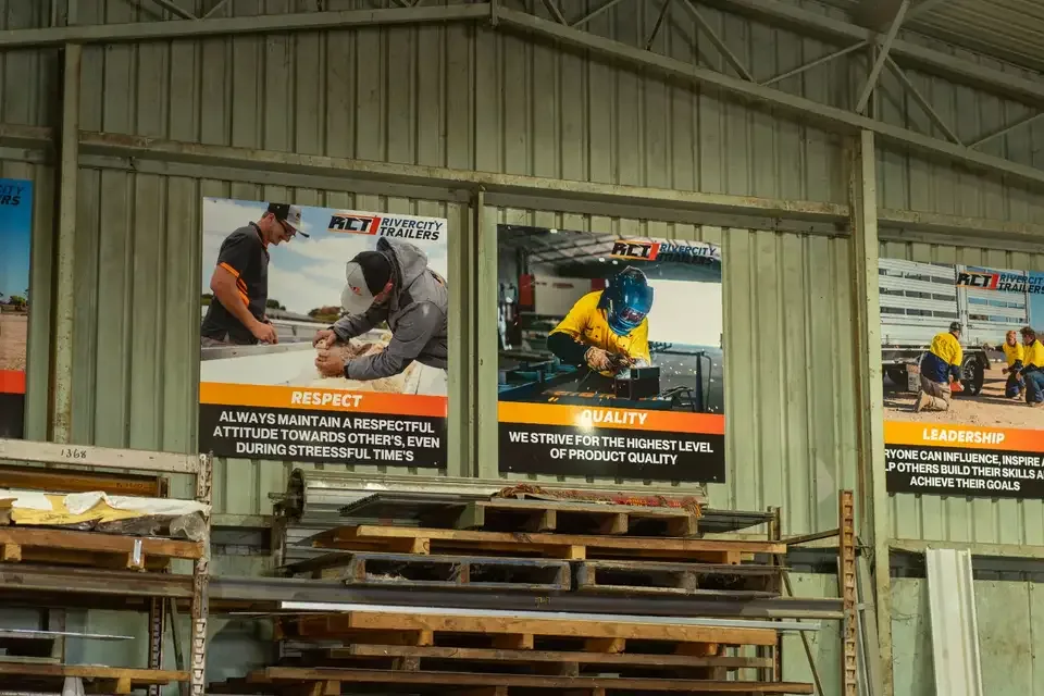 Rivercity Trailers company values posters on the workshop wall