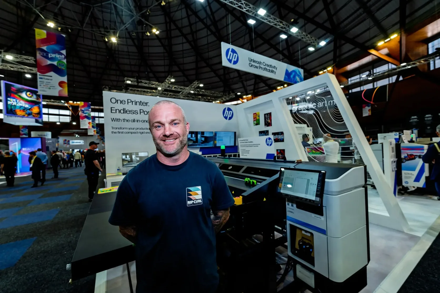 Trent Eagle at an HP printing stand at a trade show